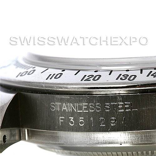 This image shows a close-up view of the case side and bezel of a Rolex Daytona 116520 Men's Stainless Steel Black Dial 116520 Men's Stainless Steel Black Dial watch, focusing on the stainless steel marking and serial number.
