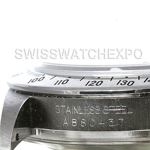This image shows a close-up of the case and bezel of a Rolex Daytona 16520 Men's Stainless Steel White Dial 16520 Men's Stainless Steel White Dial watch, highlighting its stainless steel build and the serial number.