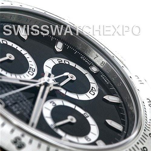 This image shows a close-up angled view of the dial and bezel of a Rolex Daytona 116520 Men's Stainless Steel Black Dial 116520 Men's Stainless Steel Black Dial watch.
