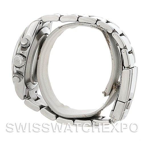 The image shows a side view of the Rolex Daytona 116520 Men's Stainless Steel White Dial 116520 Men's Stainless Steel White Dial watch, featuring the crown and pushers, along with part of the bracelet.