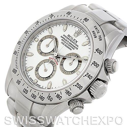 The image shows a close-up, angled view of a Rolex Daytona 116520 Men's Stainless Steel White Dial 116520 Men's Stainless Steel White Dial watch, featuring its bezel, dial, and pushers.