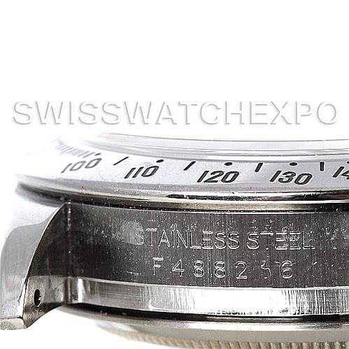 This image shows a close-up of the side view of the Rolex Daytona 116520 Men's Stainless Steel White Dial 116520 Men's Stainless Steel White Dial watch case, focusing on the bezel and the engraved serial number.