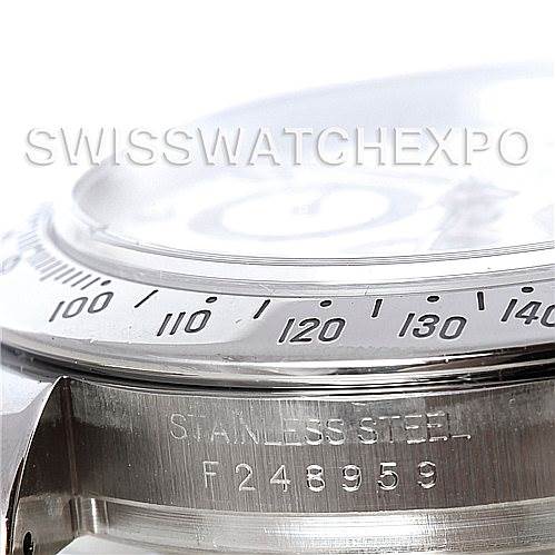 The image shows a close-up of the bezel, case, and serial number of a Rolex Daytona 116520 Men's Stainless Steel White Dial 116520 Men's Stainless Steel White Dial watch.