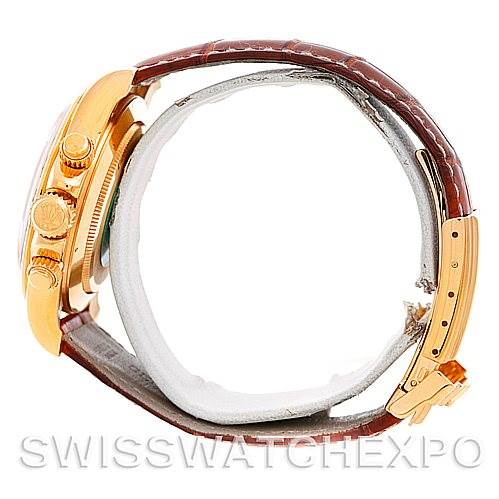 The image shows a side view of a Rolex Daytona 16518 Men's Yellow Gold White Dial 16518 Men's Yellow Gold White Dial watch with a brown leather strap and gold case.