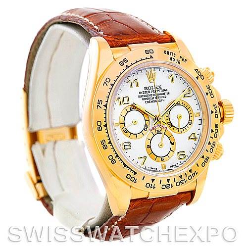 The image shows a gold Rolex Daytona 16518 Men's Yellow Gold White Dial 16518 Men's Yellow Gold White Dial watch at a 3/4 angle, highlighting the dial, bezel, pushers, and brown leather strap.