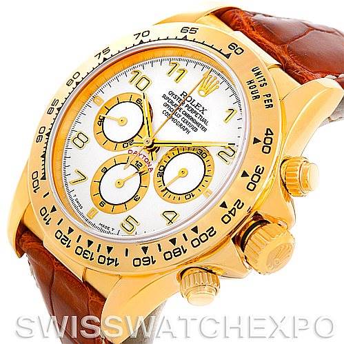 The image shows a close-up angle of a Rolex Daytona 16518 Men's Yellow Gold White Dial 16518 Men's Yellow Gold White Dial watch, highlighting the dial, bezel, crown, and leather strap.