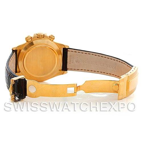 The image shows the back view of a Rolex Daytona 16518 Men's Yellow Gold White Dial 16518 Men's Yellow Gold White Dial watch, highlighting the gold case and open leather strap with a deployment clasp.