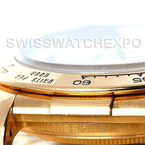 This close-up image showcases the bezel, side case, and part of the bracelet of a Rolex Daytona 16518 Men's Yellow Gold White Dial 16518 Men's Yellow Gold White Dial watch.