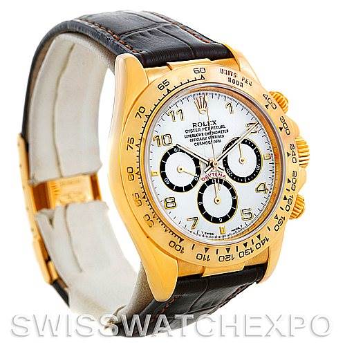 This image shows a Rolex Daytona 16518 Men's Yellow Gold White Dial 16518 Men's Yellow Gold White Dial watch at an angled side view, highlighting its gold case, white dial, three subdials, and black leather strap.