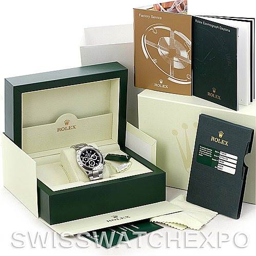 This image shows a Rolex Daytona 116520 Men's Stainless Steel Black Dial 116520 Men's Stainless Steel Black Dial watch in its original packaging, along with manuals, tags, and a warranty card.