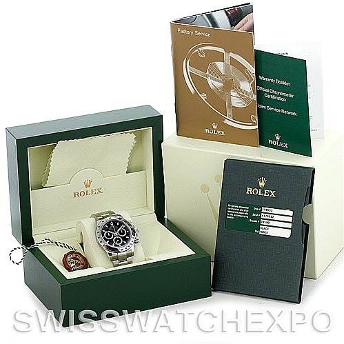 The image shows a Rolex Daytona 116520 Men's Stainless Steel Black Dial 116520 Men's Stainless Steel Black Dial watch in its box, with accompanying booklets and warranty card.