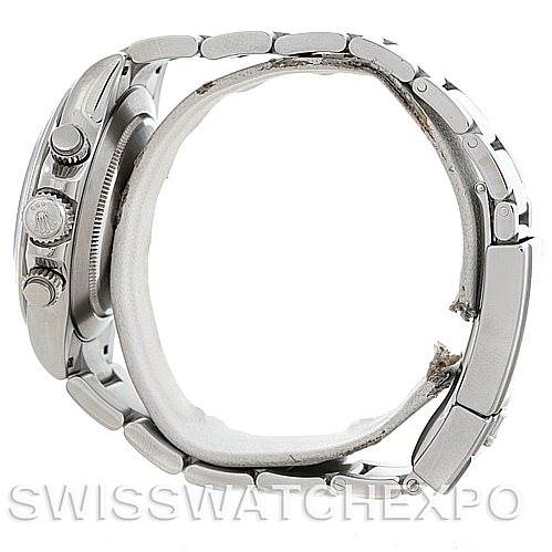 The image shows a side view of a Rolex Daytona 116520 Men's Stainless Steel Black Dial 116520 Men's Stainless Steel Black Dial watch focusing on the case, crown, and part of the bracelet.