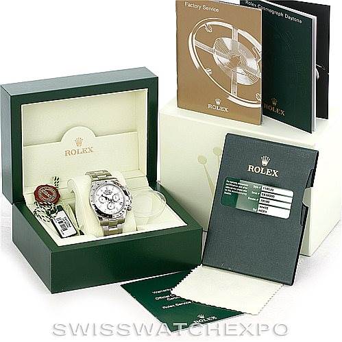 The image shows a Rolex Daytona 116520 Men's Stainless Steel White Dial 116520 Men's Stainless Steel White Dial watch in its box along with accessories, including manuals, tags, and a polishing cloth.