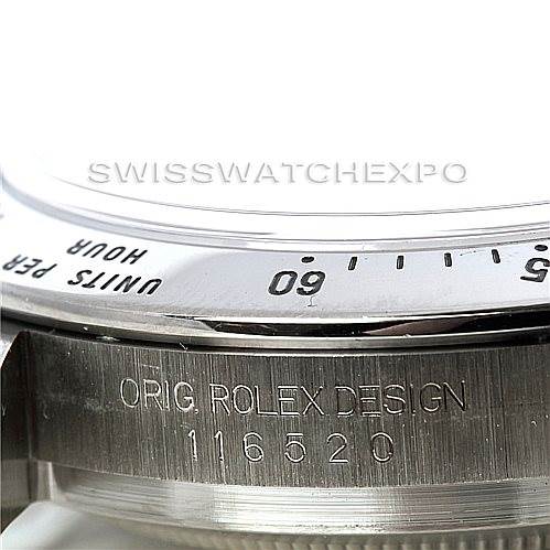 This close-up shows the bezel and serial number engraving on a Rolex Daytona 116520 Men's Stainless Steel White Dial 116520 Men's Stainless Steel White Dial watch.