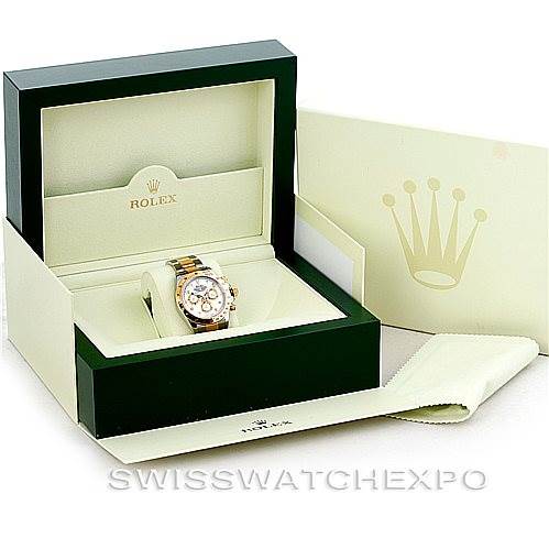 The image shows a Rolex Daytona 116523 Men's Steel and Gold (two tone) White Dial 116523 Men's Steel and Gold (two tone) White Dial watch in its open box, with the packaging and accessories displayed around it.