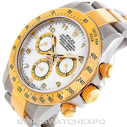 This image shows the Rolex Daytona 116523 Men's Steel and Gold (two tone) White Dial 116523 Men's Steel and Gold (two tone) White Dial watch at an angle emphasizing the face, bezel, crown, and part of the bracelet.