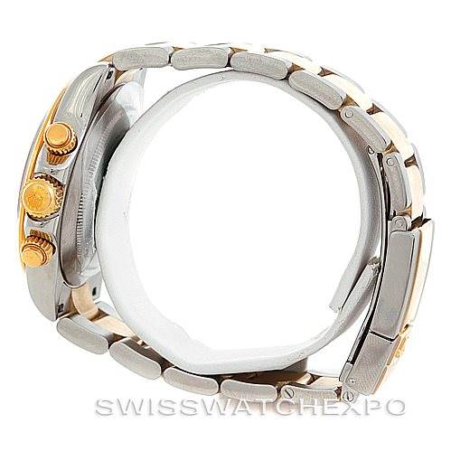 The image shows a side view of a Rolex Daytona 116523 Men's Steel and Gold (two tone) White Dial 116523 Men's Steel and Gold (two tone) White Dial watch displaying its bracelet, clasp, and crown with pushers.