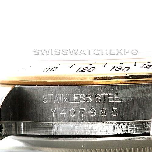 This image shows a side angle of the Rolex Daytona 116523 Men's Steel and Gold (two tone) White Dial 116523 Men's Steel and Gold (two tone) White Dial watch, focusing on the serial number and part of the bezel.