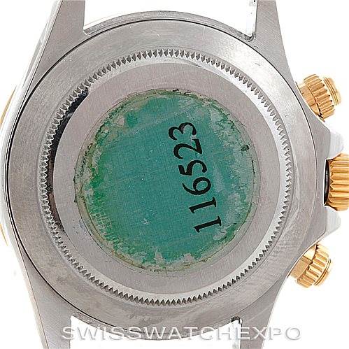 This is an image of the case back and crown of a Rolex Daytona 116523 Men's Steel and Gold (two tone) White Dial 116523 Men's Steel and Gold (two tone) White Dial watch, showing its model number 116523.