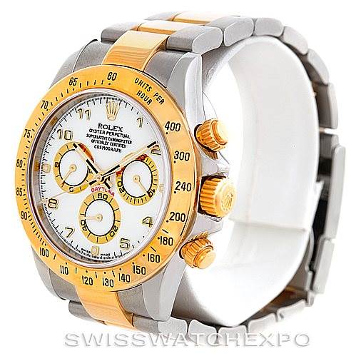 The image shows a Rolex Daytona 116523 Men's Steel and Gold (two tone) White Dial 116523 Men's Steel and Gold (two tone) White Dial watch at a three-quarter angle, highlighting the face, bezel, and two-tone band.