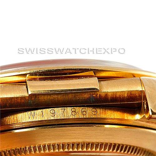 This image shows a close-up angle of the side of a Rolex Daytona 16518 Men's Yellow Gold White Dial 16518 Men's Yellow Gold White Dial watch, focusing on the part where the bracelet meets the case.