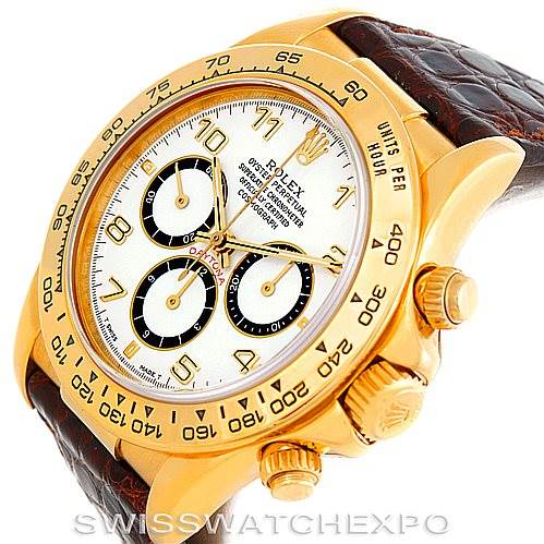 This image shows a angled view of a Rolex Daytona 16518 Men's Yellow Gold White Dial 16518 Men's Yellow Gold White Dial watch featuring its gold bezel, white dial, and brown leather strap.