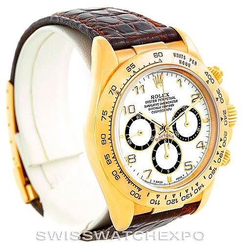 The Rolex Daytona 16518 Men's Yellow Gold White Dial 16518 Men's Yellow Gold White Dial watch is shown at a 3/4 angle, highlighting the face, bezel, crown, pushers, and leather strap.
