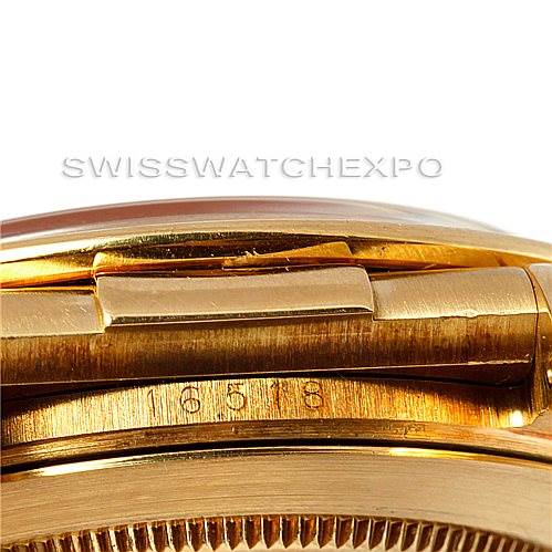 The image shows a close-up side view of a Rolex Daytona 16518 Men's Yellow Gold White Dial 16518 Men's Yellow Gold White Dial watch clasp, highlighting its golden finish and visible serial numbers.