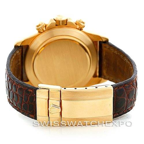 This image shows the back of a Rolex Daytona 16518 Men's Yellow Gold White Dial 16518 Men's Yellow Gold White Dial watch with a gold case and brown leather strap.