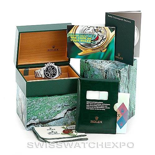 This image shows a Rolex Daytona 116520 Men's Stainless Steel Black Dial 116520 Men's Stainless Steel Black Dial watch with its open box, documents, and accessories from a frontal angle.