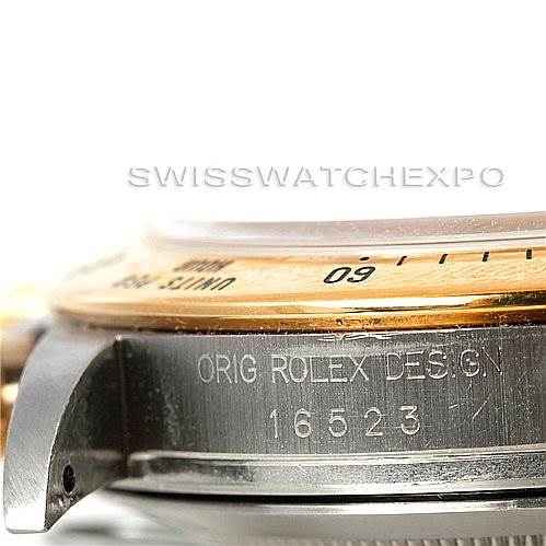 The image shows a close-up side view of a Rolex Daytona 16523 Men's Steel and Gold (two tone) White Dial 16523 Men's Steel and Gold (two tone) White Dial watch, focusing on the bezel and engraved model number "16523."