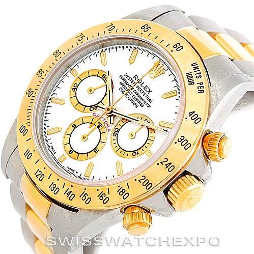 This is an angled view of a Rolex Daytona 16523 Men's Steel and Gold (two tone) White Dial 16523 Men's Steel and Gold (two tone) White Dial watch, showing the face, crown, and part of the bracelet.