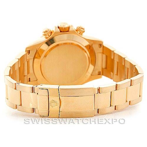 The image shows the back view of a Rolex Daytona 116528 Men's Yellow Gold Black Dial 116528 Men's Yellow Gold Black Dial watch, including its case back and metal bracelet.