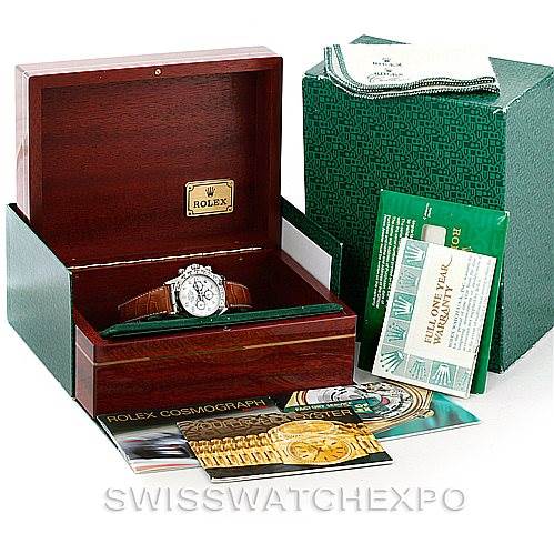 The image shows a Rolex Daytona 16519 Men's White Gold White Dial 16519 Men's White Gold White Dial watch in its box, along with manuals, tags, and a polishing cloth.
