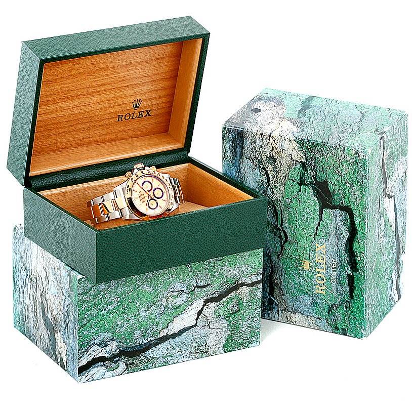 The image shows a Rolex Daytona 16523 Men's Steel and Gold (two tone) Champagne Dial 16523 Men's Steel and Gold (two tone) Champagne Dial watch placed inside an open Rolex green and wood-tone box with the outer box beside it.