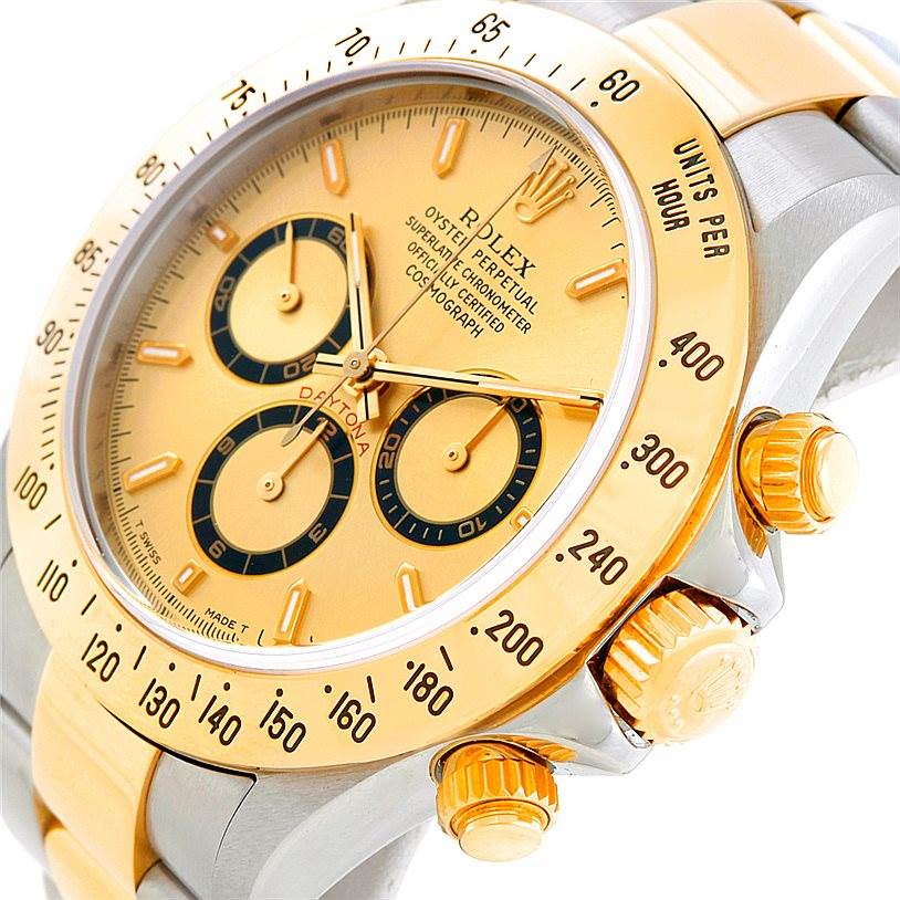 The image shows a close-up angle of the Rolex Daytona 16523 Men's Steel and Gold (two tone) Champagne Dial 16523 Men's Steel and Gold (two tone) Champagne Dial watch, capturing the dial, bezel, and side buttons.