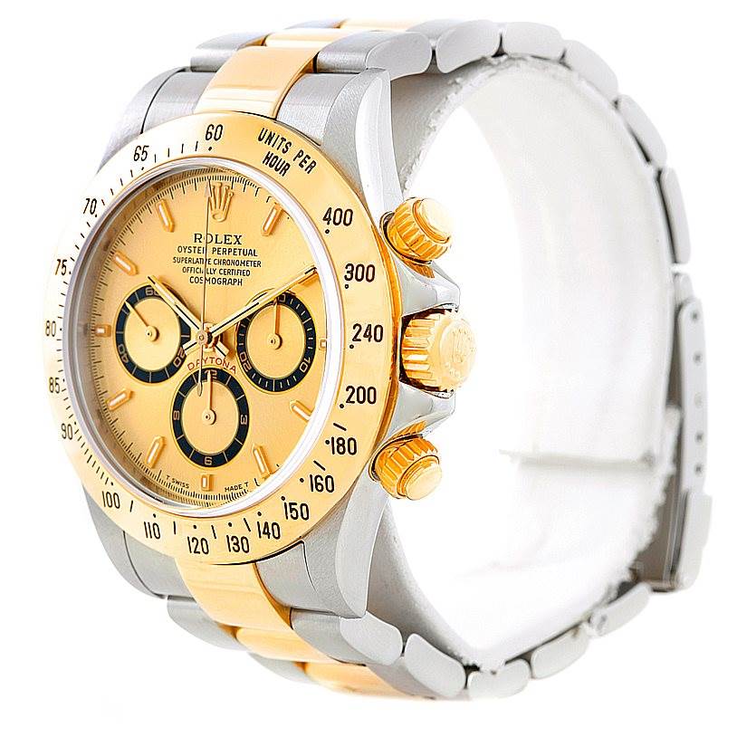 The image shows a Rolex Daytona 16523 Men's Steel and Gold (two tone) Champagne Dial 16523 Men's Steel and Gold (two tone) Champagne Dial watch at an angle displaying the face, bezel, push buttons, crown, and part of the bracelet.