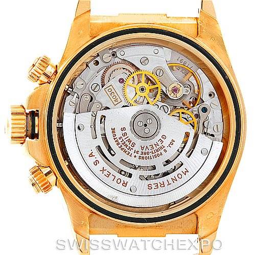 This image shows the rear view of a Rolex Daytona 16518 Men's Yellow Gold White Dial 16518 Men's Yellow Gold White Dial watch, displaying its intricate movement and inner mechanics.