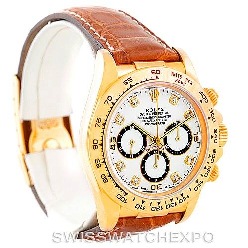 This image shows a Rolex Daytona 16518 Men's Yellow Gold White Dial 16518 Men's Yellow Gold White Dial watch at an angled view, displaying its gold case, white dial, and brown leather strap.