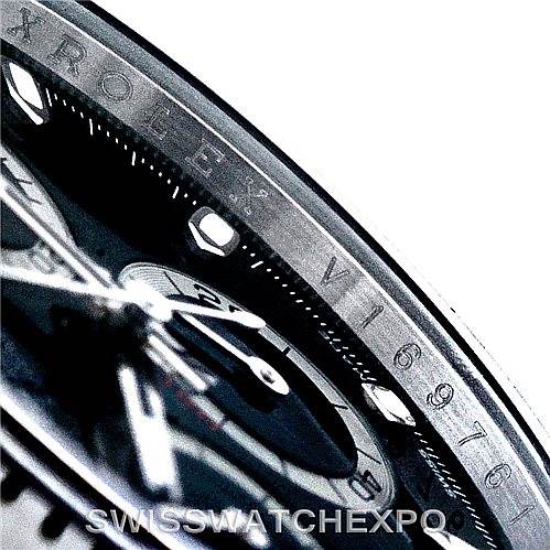This close-up image of the Rolex Daytona 116520 Men's Stainless Steel Black Dial 116520 Men's Stainless Steel Black Dial model shows the bezel, part of the dial, and chronograph sub-dials.