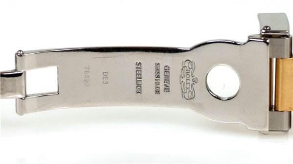 This image shows the inside of the clasp for a Rolex Daytona 116523 Men's Stainless Steel Black Dial 116523 Men's Stainless Steel Black Dial watch, displaying the engraved text and Rolex logo.