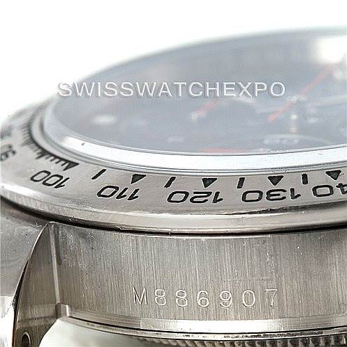 The image shows a close-up of the bezel and side case of a Rolex Daytona 116509 Men's White Gold Black Dial 116509 Men's White Gold Black Dial watch, including partially visible serial number details.