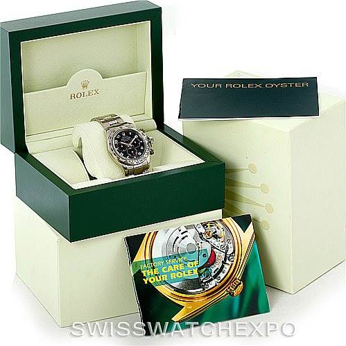 The image shows a Rolex Daytona 116509 Men's White Gold Black Dial 116509 Men's White Gold Black Dial watch in its box with associated booklets and packaging.