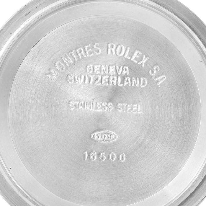 This image shows the inside of the case back of a Rolex Daytona 16523 Men's Steel and Gold (two tone) White Dial 16523 Men's Steel and Gold (two tone) White Dial, featuring the brand, origin, material, and model number.