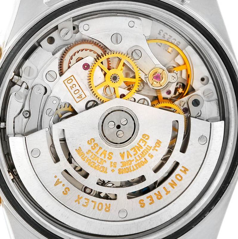 The image shows the movement and internal mechanisms of a Rolex Daytona 16523 Men's Steel and Gold (two tone) White Dial 16523 Men's Steel and Gold (two tone) White Dial watch from the backside.