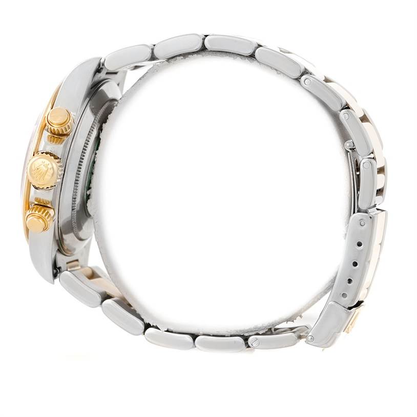 This image shows a side view of a Rolex Daytona 16523 Men's Steel and Gold (two tone) White Dial 16523 Men's Steel and Gold (two tone) White Dial watch, highlighting its crown, pushers, and bracelet.