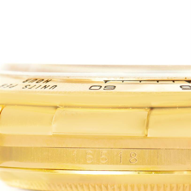 This image shows a side angle of the case, bezel, and engraved model number of a Rolex Daytona 16518 Men's Yellow Gold White Dial 16518 Men's Yellow Gold White Dial watch.