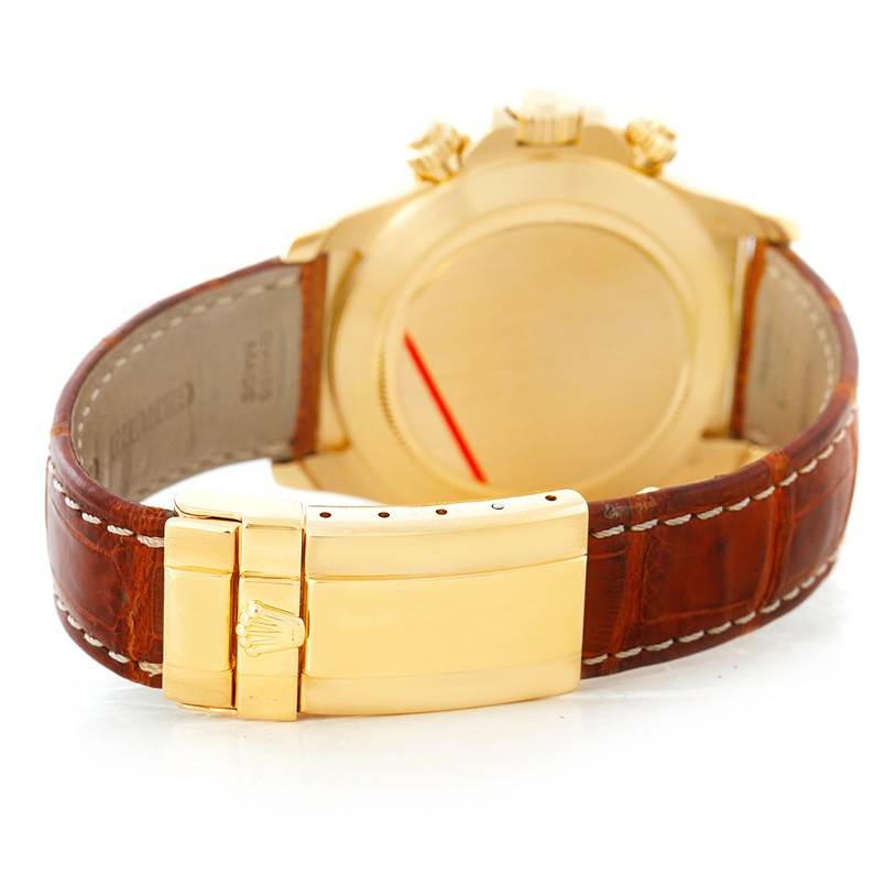 The image shows the back of a Rolex Daytona 16518 Men's Yellow Gold White Dial 16518 Men's Yellow Gold White Dial watch, highlighting its clasp and leather strap.