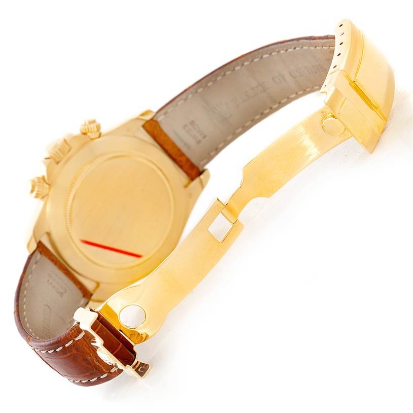 The image shows the backside and clasp mechanism of a Rolex Daytona 16518 Men's Yellow Gold White Dial 16518 Men's Yellow Gold White Dial watch with a leather strap.