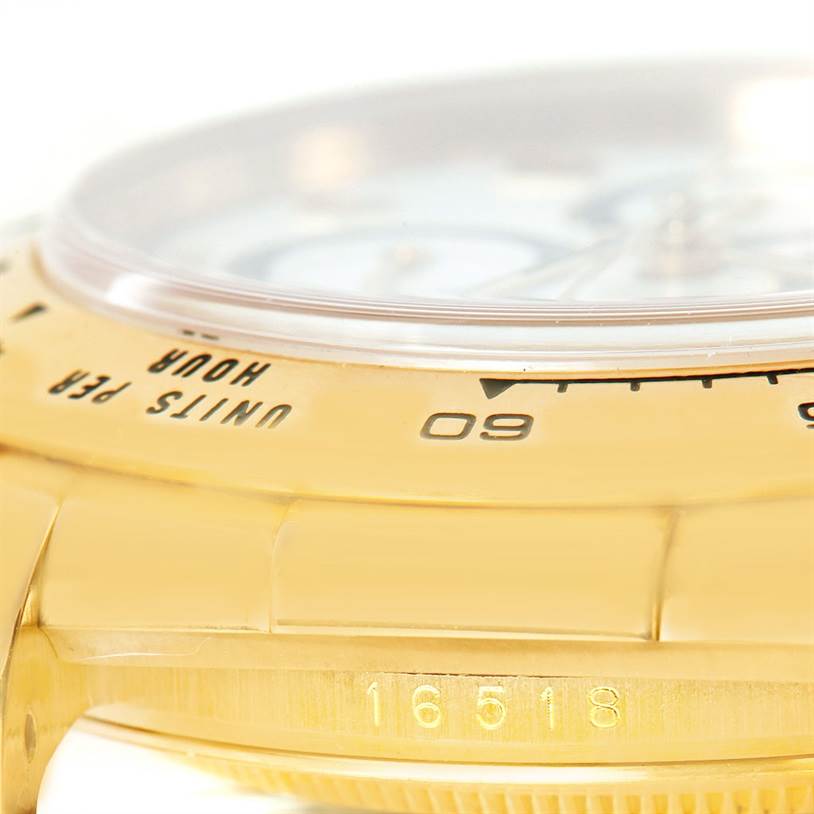 The image shows a close-up side angle of a Rolex Daytona 16518 Men's Yellow Gold White Dial 16518 Men's Yellow Gold White Dial watch, highlighting the bezel, part of the bracelet, and case with model number "16518."